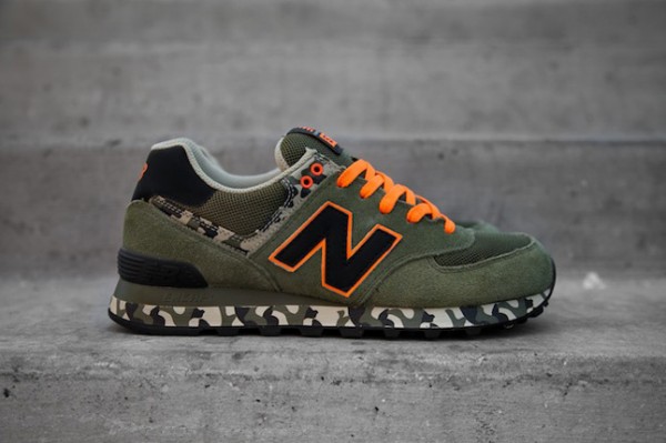 les lacets et le âNâ de la marque est mis en Ã©vidence avec un contour orange fluorescent du plus 